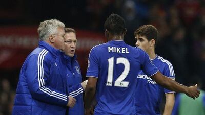 Chelsea's John Obi Mikel talks to manager Guus Hiddink during their Premier League match against Manchester United on Monday night. Phil Noble / Reuters / December 28, 2015