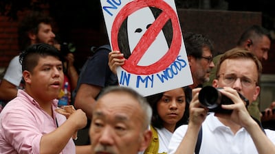 A counter-protester holds a sign near a white nationalist-led rally marking the one year anniversary of the 2017 Charlottesville ‘Unite the Right’ protests. Reuters