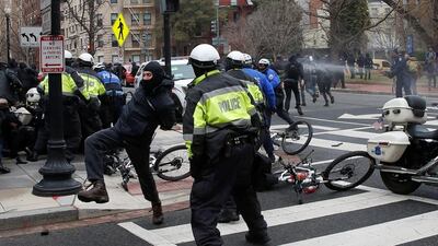 Protesters clash with police while demonstrating against US president Donald Trump on the sidelines of his inauguration in Washington, DC, on January 20, 2017. Adrees Latif / Reuters