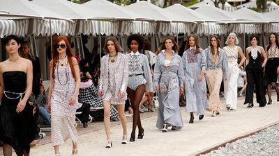 Models at the Chanel cruise 2022/23 fashion show. Photo: EPA