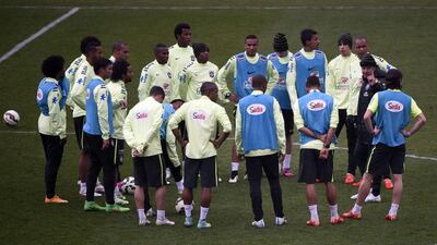 Brazil's players listen to coach Dunga, second from right, as they prepare to take on Chile. Martin Bureau / AFP