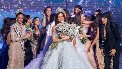 Maya Reaidy (C) poses after winning the Miss Lebanon 2018 beauty pageant, next to Lebanese-American actress Miss USA 2010 Rima Fakih (R) and Miss Universe 2017 Demi-Leigh Nel-Peters (L) at forum De Beirut in Beirut, Lebanon, 30 September 2018. Photo / EPA