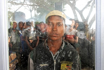 Rohingya men in Kuala Idi Rayeuk port after arriving on a wooden boat in Aceh Timur, Indonesia, December 4, 2018. Antara Foto/Syifa Yulinnas via Reuters