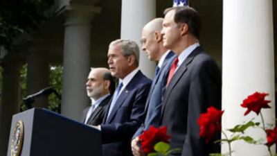 President Bush, second from left, accompanied by, from left, Federal Reserve Chairman Ben Bernanke, Treasury Secretary Henry Paulson, and Securities and Exchange Commission (SEC) Chairman Christopher Cox in the Rose Garden of the White House in Washington.