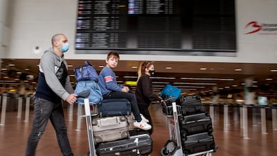 Travelers walk through the main departures hall at Brussels Airport in Zaventem, Belgium. As of April 19, non-essential travel is again authorized but strongly discouraged by the government. EPA