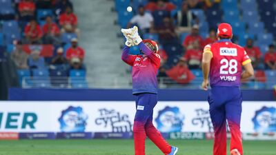 Dubai Capitals' Robin Uthappa takes a catch to dismiss Wanindu Hasaranga of Desert Vipers.