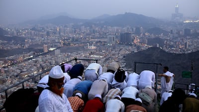 Muslim men attend evening prayer at the top of Mount Al-Noor where the Prophet Mohammed received the first words of the Quran in Mecca, Saudi Arabia. Abir Abdullah / EPA