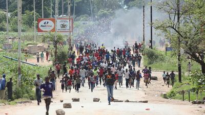 Protesters gather on the streets during demonstrations over the hike in fuel prices in Harare, Zimbabwe. Tsvangirayi Mukwazhi / AP