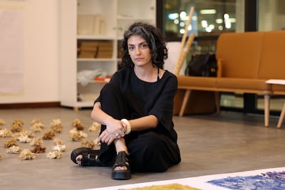 Nour Hage's work involves the use of dye and the process of mourning a loss through art. Chris Whiteoak / The National