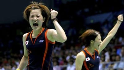 Miyuki Maeda and Satoko Suetsuna celebrate victory.