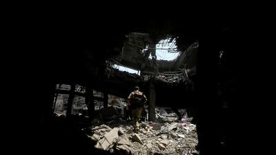 Members of the Emergency Response Division walk in a destroyed building at the Old City of Mosul, Iraq July 9, 2017. REUTERS/Alaa Al-Marjani TPX IMAGES OF THE DAY
