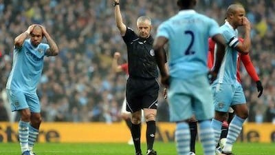 Referee Chris Foy sends off Manchester City’s Vincent Kompany yesterday.