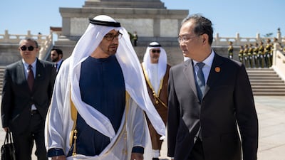 Sheikh Mohamed with Deng Li, China's Vice Minister of Foreign Affairs, at the monument.