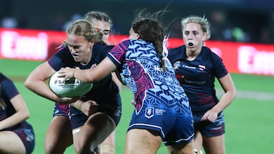 Dubai Warriors take on Dubai College during the Gulf Under-19 Girls final at the Emirates Dubai Sevens. Victor Besa / The National