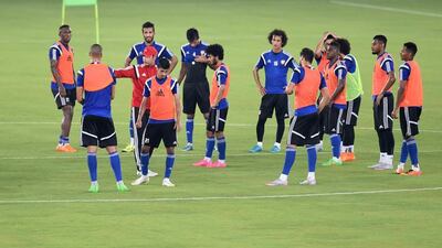 UAE coach Mahdi Ali, centre, speaks to his players during a team training session prior to their World Cup qualifier against Malaysia. 1 September 2015. Photo Courtesy UAE FA
