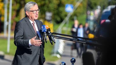 European Commission President Jean-Claude Juncker talks with journalists as he arrives for a European Union summit. AFP PHOTO/JANEK SKARZYNSKI