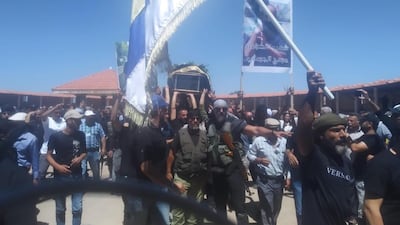 Druze militia leader Mr Al Jaramani's coffin is carried to his funeral