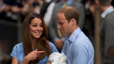 Britain's Prince William and Kate, Duchess of Cambridge react as they talk to the media whilst holding the Prince of Cambridge. AP Photo / Matt Dunham