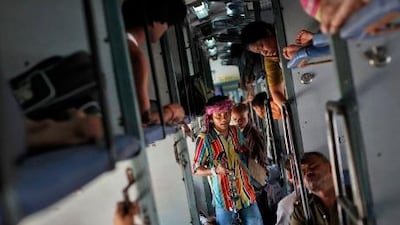 A man sells locks and chains inside a compartment of a passenger train en route to Kolkata. By the end of the day, about 40 people on average will have died somewhere on the 64,000km Indian Railways network.