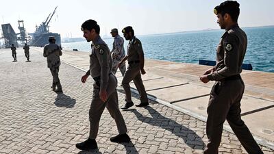 Saudi security forces walk along a pier at the docks of Ras Al Khair port, about 185 kilometres north of Dammam in Saudi Arabia's eastern province. AFP