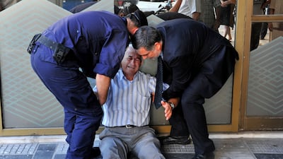 “I see my fellow citizens begging for a few cents to buy bread. I see more and more suicides. I am a sensitive person. I cannot stand to see my country in this situation,” says 77-year-old Giorgos Chatzifotiadis. Sakis Mitrolidis/AFP Photo