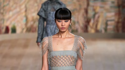 While many Dior haute couture looks were focused on daywear, this gown has a panel of woven threads