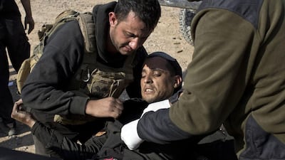 A wounded Iraqi special forces soldier is treated at a field hospital in Gogjali, on the eastern edge of Mosul, on November 6, 2016. Marko Drobnjakovic / AP Photo