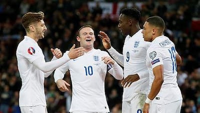 England’s Danny Welbeck, second right, celebrates with teammates after scoring a goal during their Euro 2016 Group E qualifying match against San Marino, at Wembley Stadium in London, on Thursday, Oct. 9, 2014. AP Photo/Alastair Grant