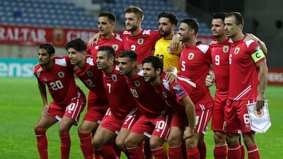 The Gibraltar team pose for photos ahead of the 2018 World Cup qualifier against Belgium. Jose Manuel Ribeiro / AFP