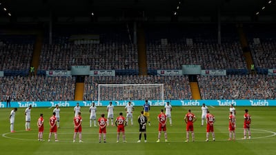Players stand during a minutes silence in respect for the late Jack Charlton before the match. Reuters
