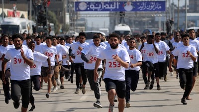 Participants in the Zayed Marathon organised by the UAE'S Gallant Knight 3 operation in Faza. Photos by Eyad Baba / AFP