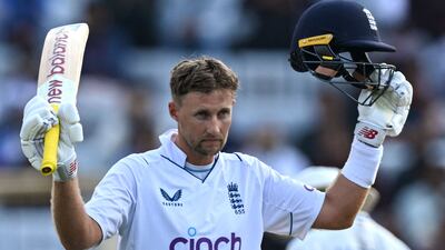 England's Joe Root celebrates reaching his century. AFP