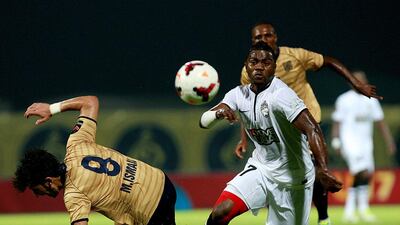 Ismail Hamadi, in white, and his Al Ahli side faced a competitive Dubai on Saturday night. Satish Kumar / The National