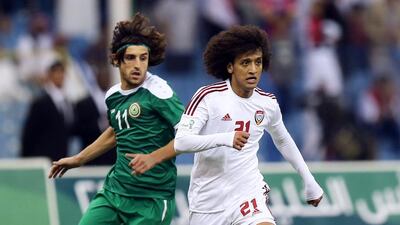 Despite close marking from Humam Tariq, left, and other members of the Iraqi team, the UAE's Omar Abdulrahman, right, was able to work his magic in the midfield, something that should worry host Saudi Arabia in the Gulf Cup of Nations semi-final on Sunday. AFP