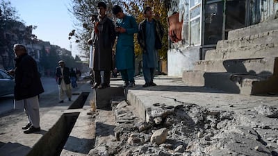 Residents gather at a site after several rockets land at Khair Khana, north west of Kabul. A series of loud explosions shook central Kabul on November 21, including several rockets that landed near the heavily fortified Green Zone where many embassies and international firms are based, officials said. AFP