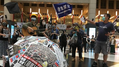 Protesters holding banners in support of Hong Kong pro-democracy demonstrators attend a rally against the Chinese government’s newly announced national security legislation for Hong Kong, at Taipei main train station in Taiwan May 23, 2020. Reuters