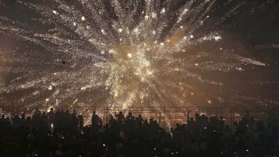 People watch fireworks before burning an effigy of demon king Ravana, marking the end of Dussehra festival in Hyderabad. Mahesh Kumar A / AP Photo