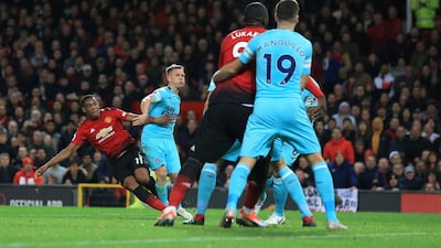 Manchester United's Anthony Martial, left, shoots and scores his side's second goal. AP Photo
