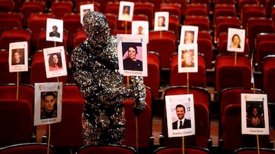 A Cirque du Soleil cast member displays a place stick for a guest during preparations for the Bafta Awards ceremony at the Royal Opera House in central London, Britain. Reuters
