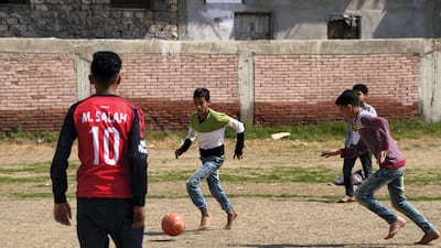 March 10, 2018- Nagrig, Egypt- Young boys play football in the yard near the youth centre, that was recently renamed for the village's local hero, Mohamed Salah. Dana Smillie for The National