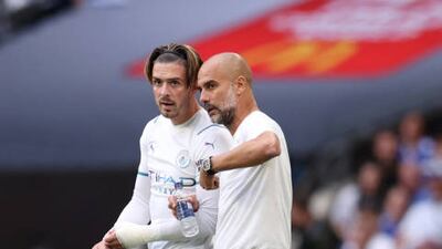 Pep Guardiola speaks to Jack Grealish during the the FA Community Shield.