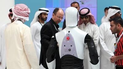 Delegates get to know a robotic guest of the International Defence Exhibition and Conference.