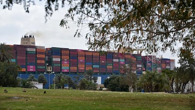 A container ship navigates Egypt's Suez Canal, a day after the Ever Given cargo vessel was dislodged from its banks. AFP
