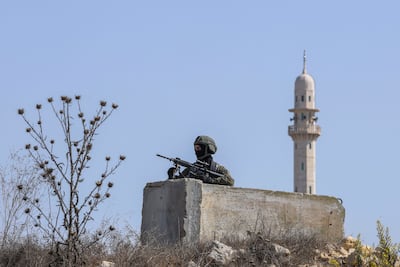 An Israeli soldier following a shooting in Hebron in the occupied West Bank. Reuters
