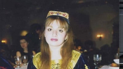 A woman poses in traditional Afghan attire, in the US in 1997, in this picture obtained from social media. Dr. Bahar Jalali/via Reuters