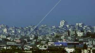 FILE - In this Jan 7, 2009 file photo, a rocket fired by Palestinian militants in the Gaza Strip is seen from southern Israel, near Israel's border with the Gaza Strip. The Hamas government in Gaza distanced itself Saturday, Feb. 6, 2010 from an earlier statement in which it expressed regret for harming Israeli civilians in rocket attacks. The apology was part of the government's response to a U.N. report that alleged both Hamas and Israel committed war crimes during Israel's Gaza offensive last winter. The U.N. report accused Hamas of firing rockets indiscriminately at Israeli civilians.