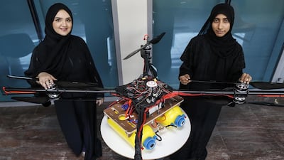 In 2015, Khalifa University students Alaya Al Maaizmi, left, and Mouza Al Shemaili, built a drone to clear fog from airport runways. Antonie Robertson / The National