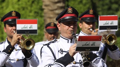 An Iraqi army honour guard performs during a welcome ceremony for the French defence minister in Baghdad on August 27. Ahmad Al-Rubaye / AFP