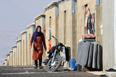 A refugee woman walks outside her makeshift shelter in the Bekaa Valley, near the border with Syria, northeastern Lebanon. EPA