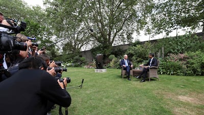 Members of the press crowd together to snap the world leaders. AFP